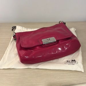 Magenta patent leather Coach shoulder bag with duster